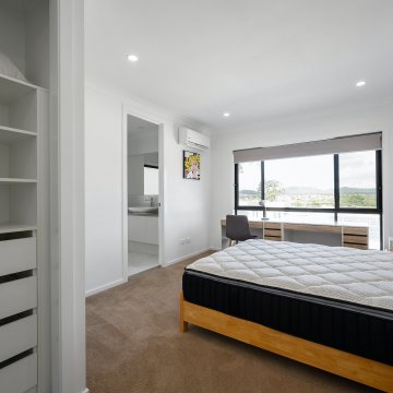 a new mattress in a living room that has yet to be set up